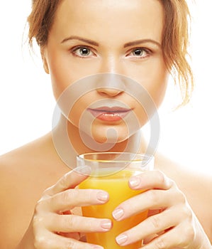 Woman isolated shot drinking orange juice