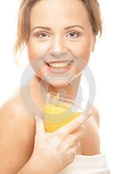 Woman isolated shot drinking orange juice