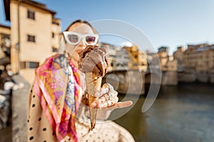 Woman with italian ice cream in Florence, Italy