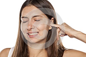 Woman with itchy ear