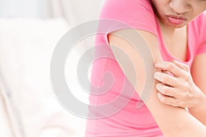 Woman with itchy skin photo
