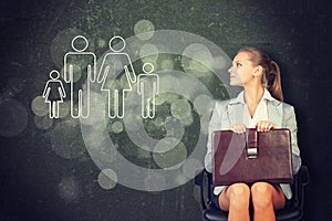 Woman in jacket, blouse sits on chair and looking