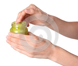 Woman with jar of hemp lotion on white background