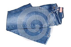 Woman jeans isolated. Folded trendy stylish female blue jeans trousers isolated on a white background. Fashionable denim pants for