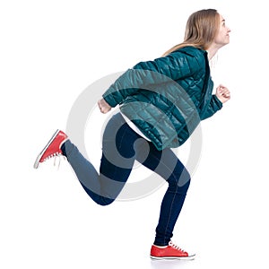 Woman in jeans and jacket running
