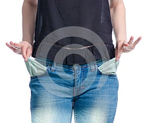 Woman in jeans showing empty pockets no money