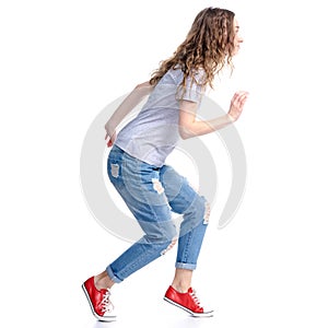 Woman in jeans sneaks sneak up