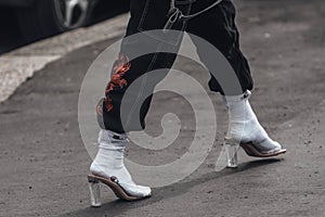 Woman in jeans with socks and mule heels