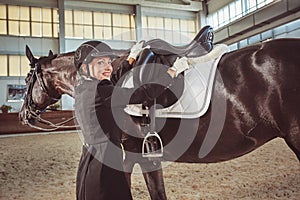 Woman jockey with his horse