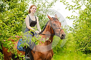 Woman jockey training riding horse. Sport activity