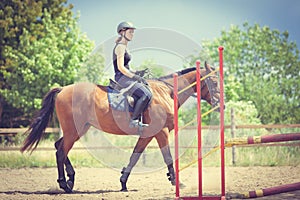 Woman jockey training riding horse. Sport activity