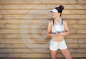 Woman jogger looking at copy space setting fitness bracelet