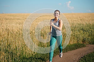 Woman jogger working out in the morning sunny day