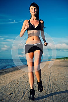 Woman jogging on the beach