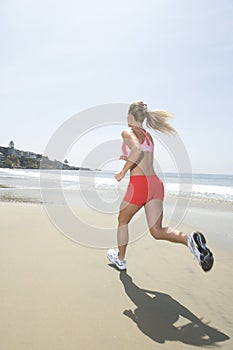 Woman Jogging At Beach