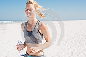 Woman jogging at beach