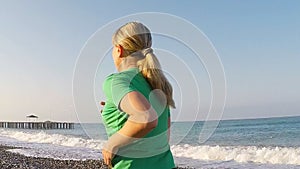 Woman jogging on the beach, slow motion