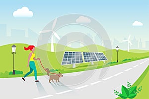 Woman jogging with dog in park, solar panels and wind turbines background