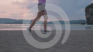 Woman Jogging by the Ocean Beach