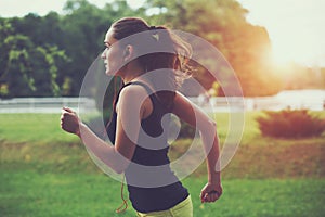 Woman jogging at park photo