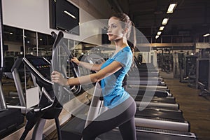 A woman jogging on a treadmill to lose weight and have a good health.