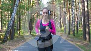 Woman jogging in wooden forest. Fitness healthy lifestyle concept.