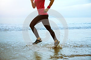 Woman jogging workout on the beach in the morning. Relax with the sea walk. Jump up and fun on workout