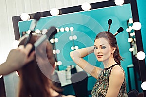 Woman joking in front of a mirror