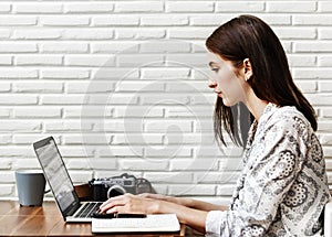 Woman journalist using computer for work