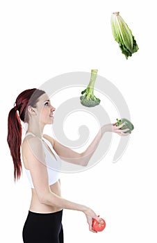 Woman juggle vegetable