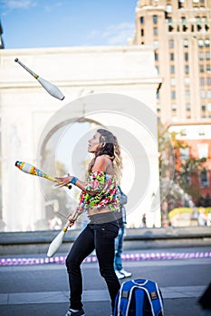 Woman Juggling with Pins, in the Middle of Greenwich Park in New