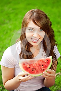 Woman with juicy watermelon in hands