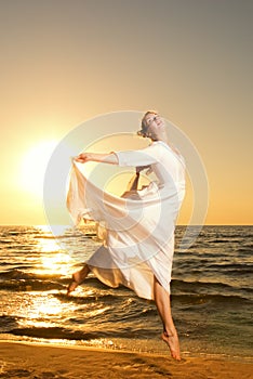 Woman jumping on a beach