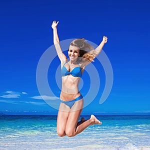 Woman jumping on beach