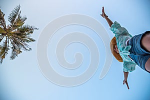 Woman jumping or crossing step over at beach