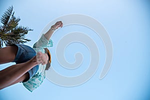 Woman jumping or crossing step over at beach