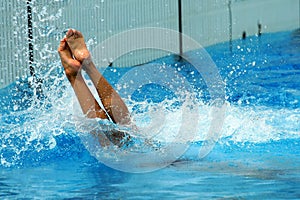 Woman jumping getting into water