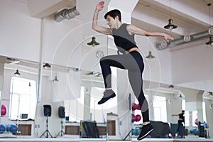 Woman jumping in the gym,