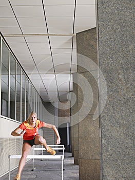 Woman Jumping Hurdles In Portico