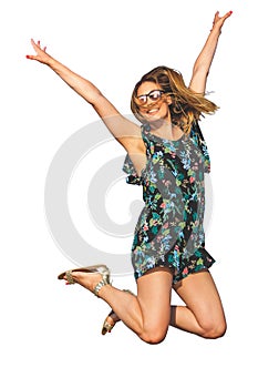 Woman jumping with joy, isolated on white background. With sunglasses and smiling.