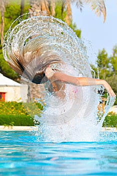 Woman is jumping out of pool