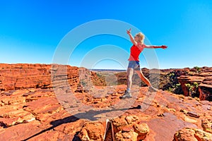 Woman jumping in Outback