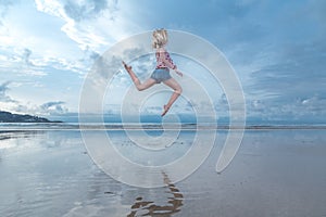 Woman jumping over water