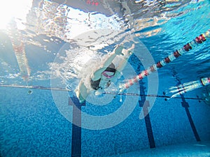 woman jumping at public pool sport activities