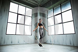 Woman jumping rope in the gym