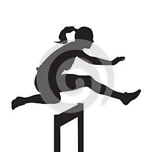 Woman jumping and running over hurdles