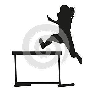 Woman jumps over the hurdle