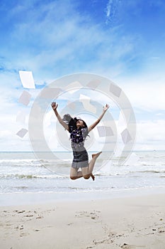 Woman jumps with paperwork