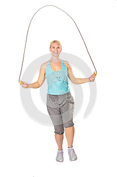 Woman jumps with skipping rope