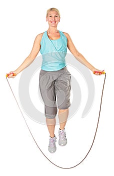 Woman jumps with a skipping rope